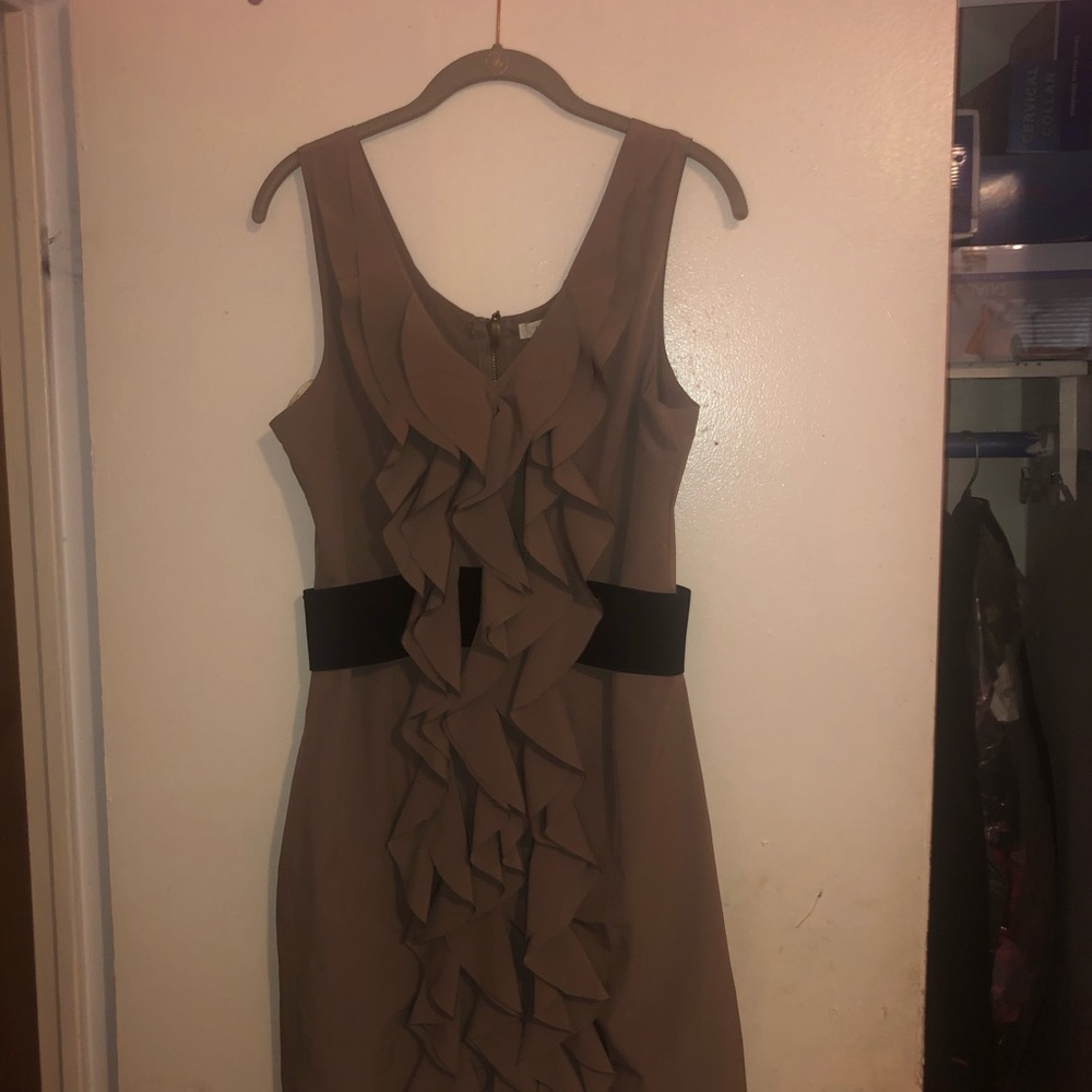 Above the knee, large, stretchy material dress.